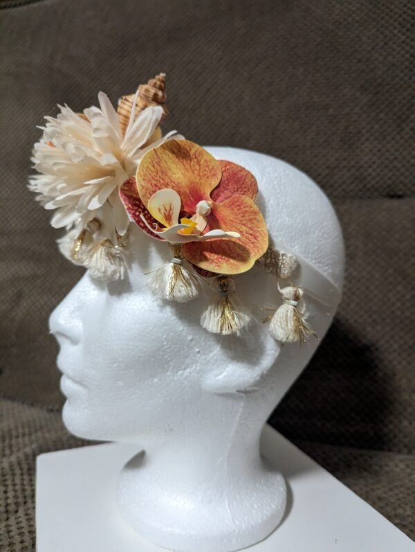 three orange orchids, 2 cream mums, ceam and gold tassels